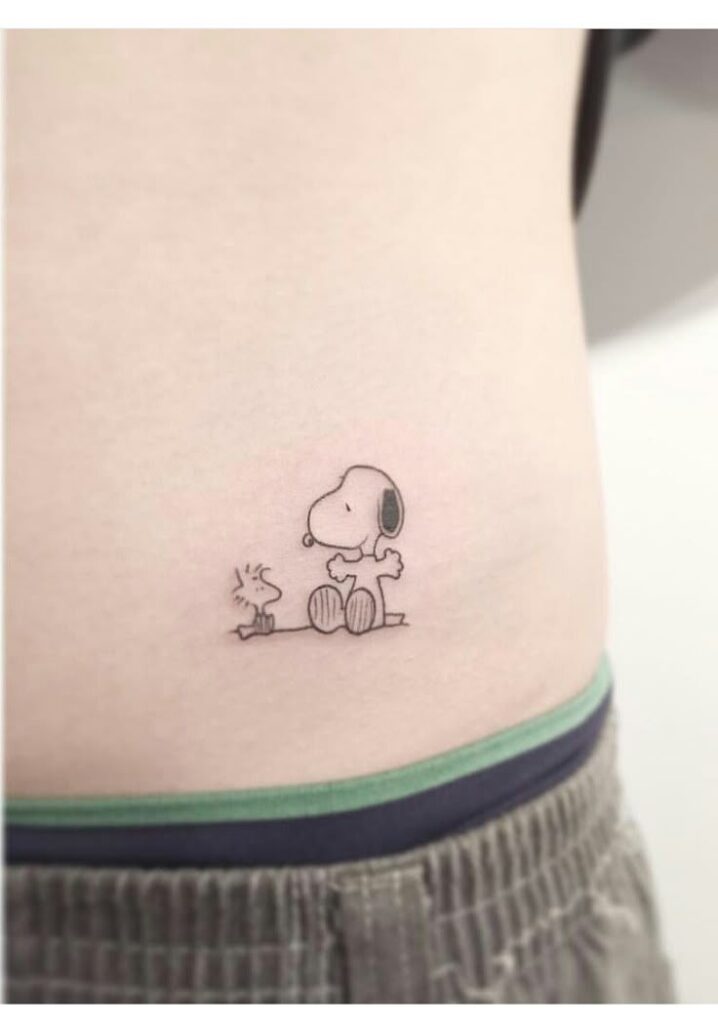 Snoopy tattoo ideas bold outline negative space symbolic