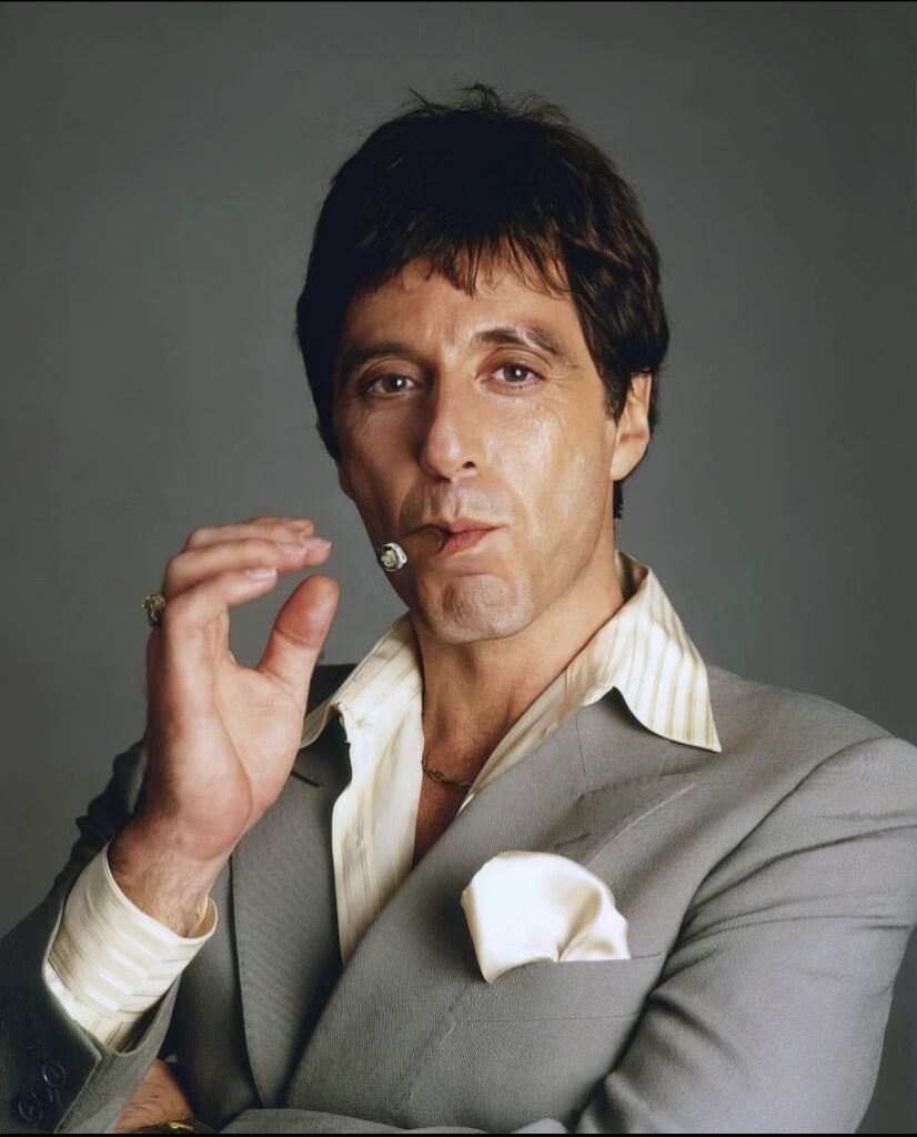 Cool Scarface profile picture with dark jacket and soft cinematic lighting