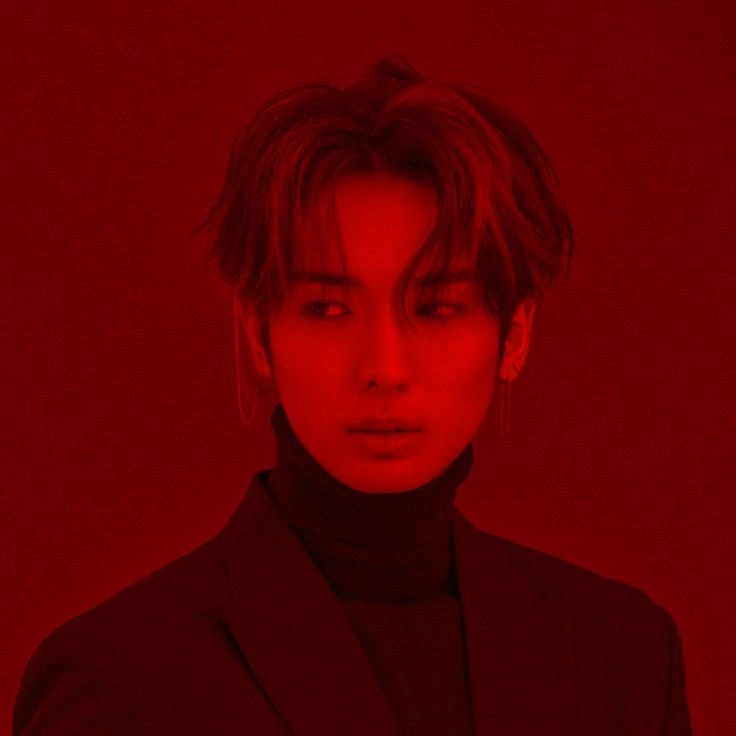 Red aesthetic PFP for boy with dark crimson lighting and urban portrait edit
