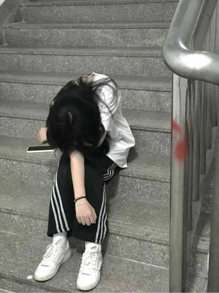Sad aesthetic girl PFP with solitary figure and faded film tones evoking longing
