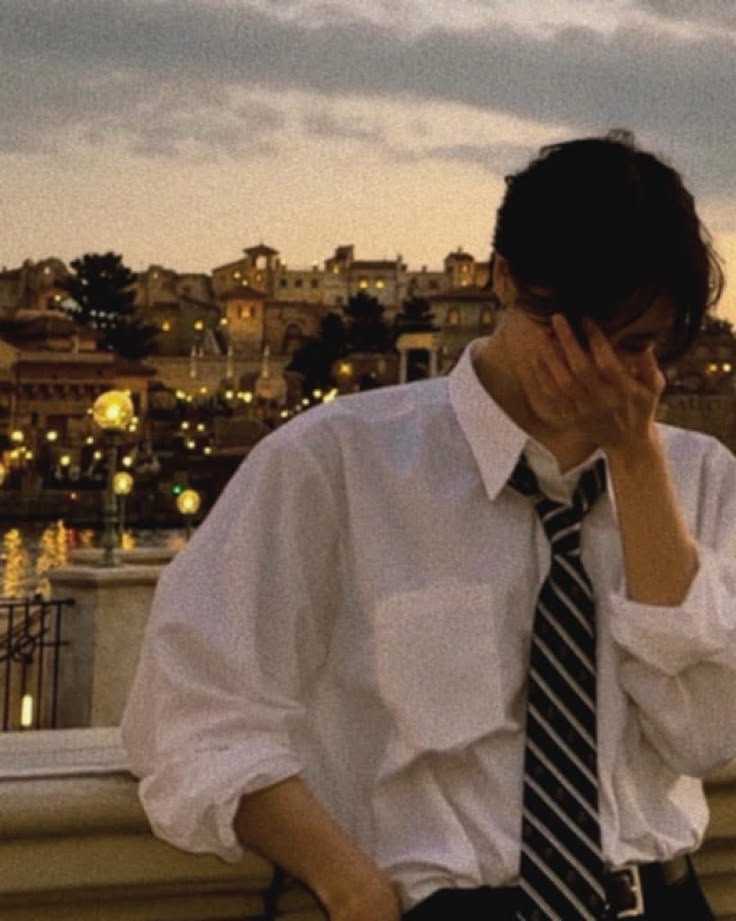 Sad aesthetic PFP male with cinematic dark neutrals and stoic shadow work