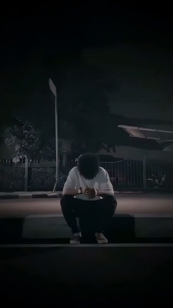 Sad PFP boy with cool tones, introspective seated posture, and minimal background