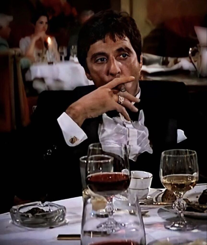 Scarface PFP smoking with Tony Montana cigar and dramatic dark background