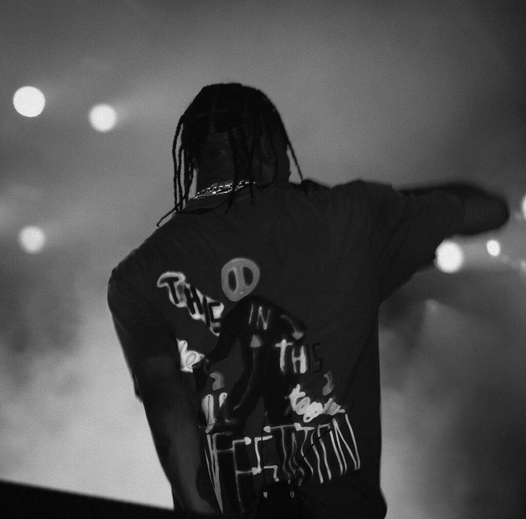 Travis Scott black and white profile picture with deep shadow contrast