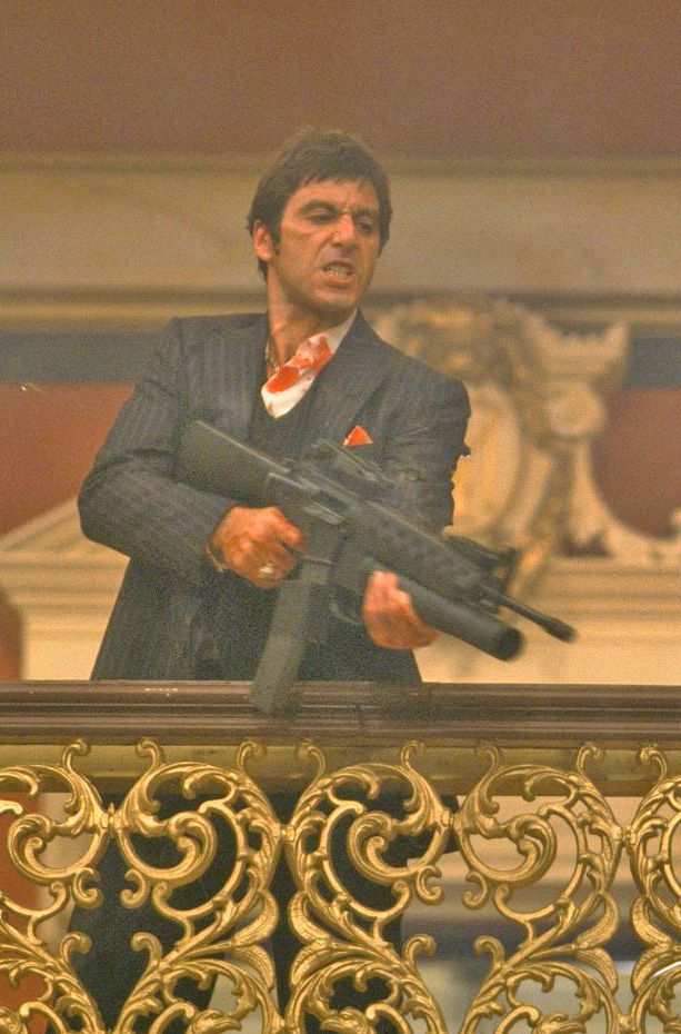 Bold tuff Scarface PFP with minimal smile and dominant posture composition
