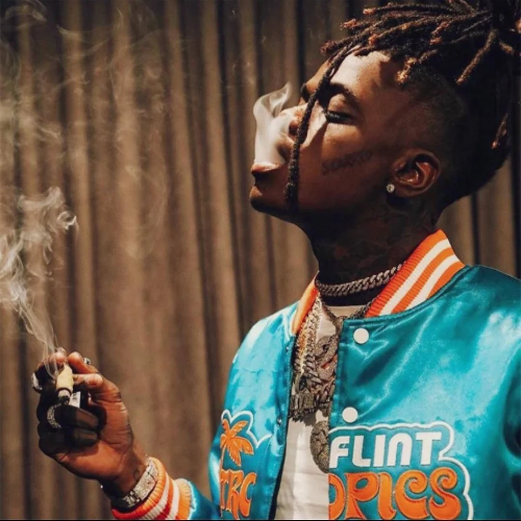 Rapper smoking PFP with urban lighting and gritty street texture